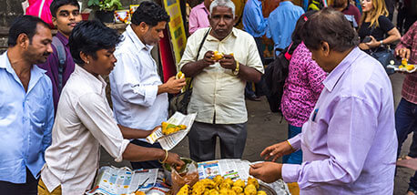 Local-people-eating-street-food-in-an-average-street-of-south-Mumbai